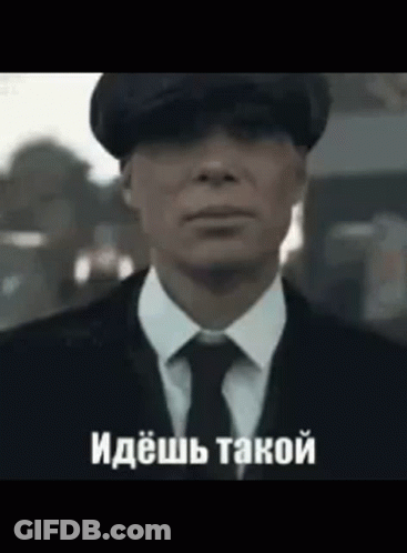 Man In Suit And Tie Wearing Hat GIF