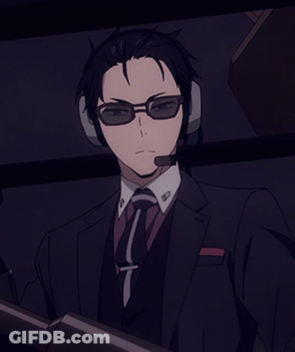 Man In Suit And Tie Wearing Headphones And Glasses GIF