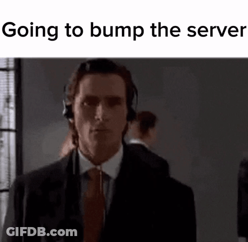 Man In Suit And Tie Wearing Headphones Looking At Camera GIF