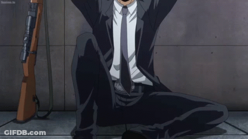 Man In Suit And Tie Wearing Mask GIF