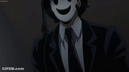 Man In Suit And Tie Wearing Mask GIF