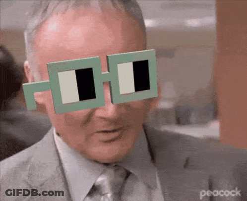 Man In Suit And Tie Wearing Peacock Sunglasses GIF