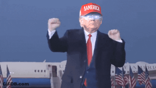 Man In Suit And Tie Wearing Red Hat Saying Samerica GIF
