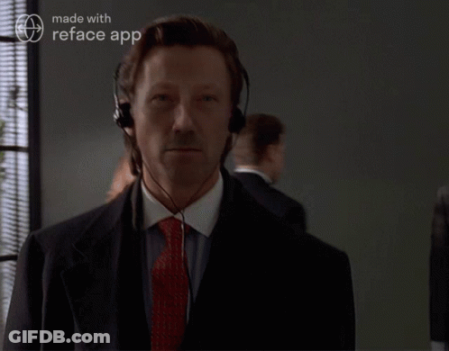 Man In Suit And Tie Wearing Reface App Headset GIF
