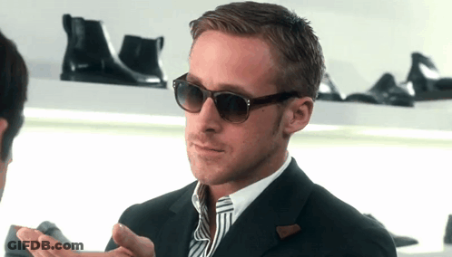Man In Suit And Tie Wearing Sunglasses GIF