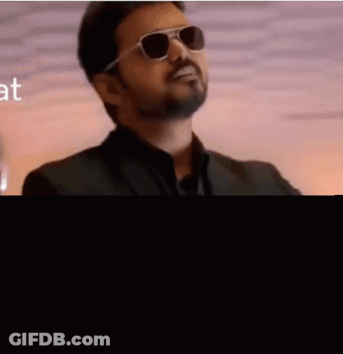 Man In Suit And Tie Wearing Sunglasses GIF