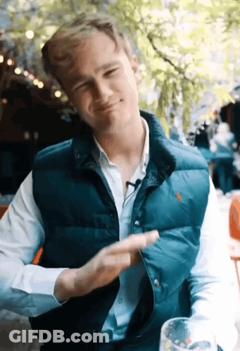 Man In Suit And Tie Wearing Tsu Hat GIF