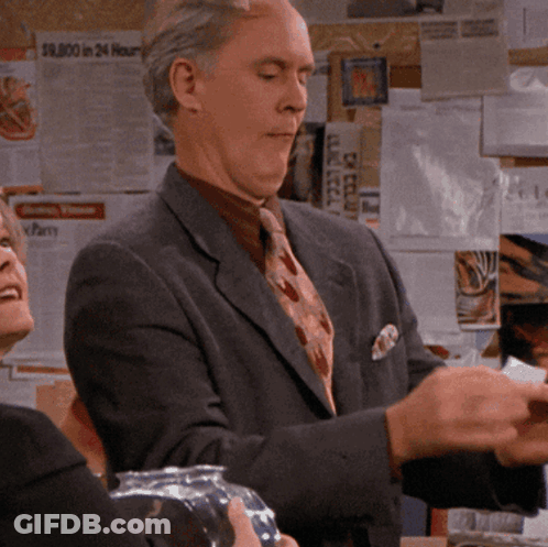 Man In Suit And Tie With $9000 Sign GIF