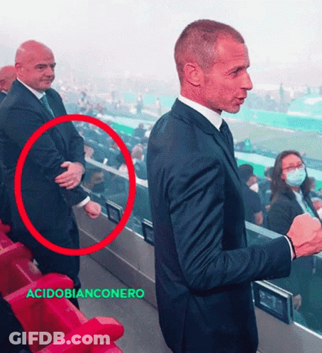 Man In Suit And Tie With Acidobianconero Red Circle GIF
