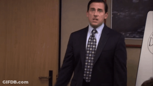 Man In Suit And Tie With Arms Outstretched GIF