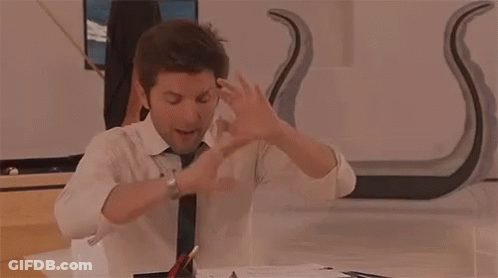 Man In Suit And Tie With Arms Outstretched GIF