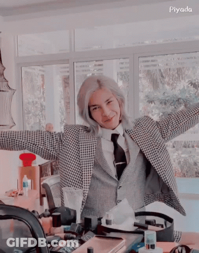 Man In Suit And Tie With Arms Outstretched GIF