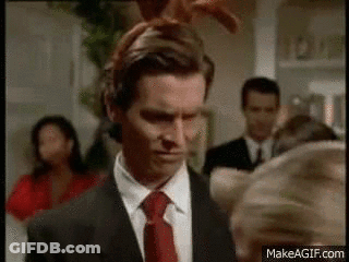 Man In Suit And Tie With Bunny Ears GIF