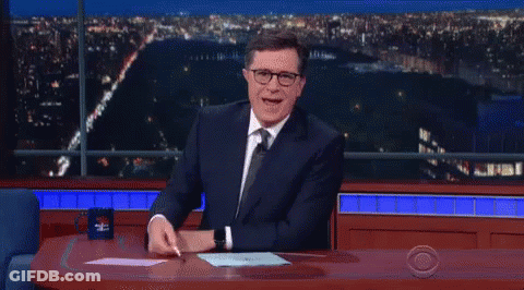 Man In Suit And Tie With CBS Mug GIF