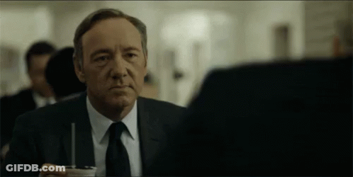 Man In Suit And Tie With Coffee GIF