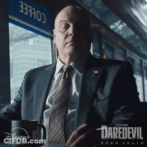 Man In Suit And Tie With Coffee GIF