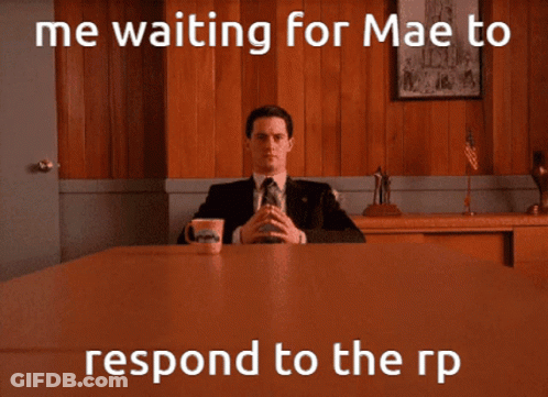 Man In Suit And Tie With Coffee By Wooden Wall GIF