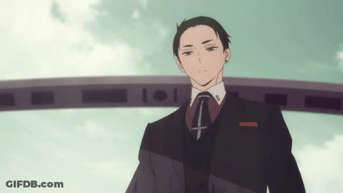 Man In Suit And Tie With Cross GIF