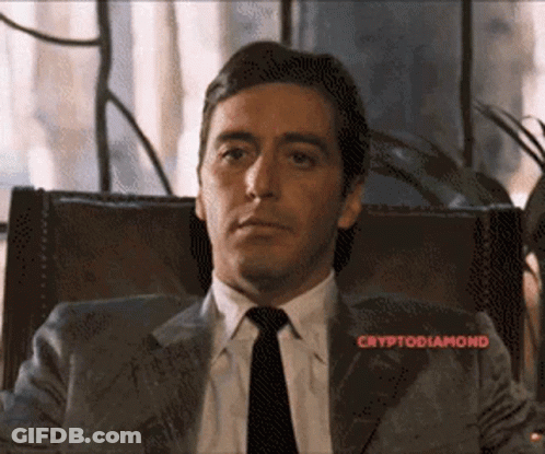 Man In Suit And Tie With Cryptodiamond Above GIF