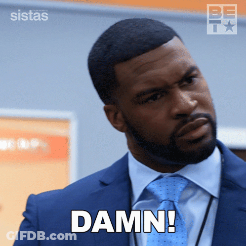 Man In Suit And Tie With Damn On Face GIF