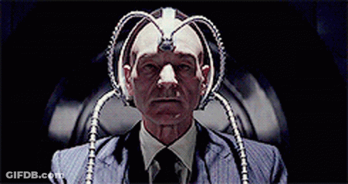 Man In Suit And Tie With Device On Head GIF
