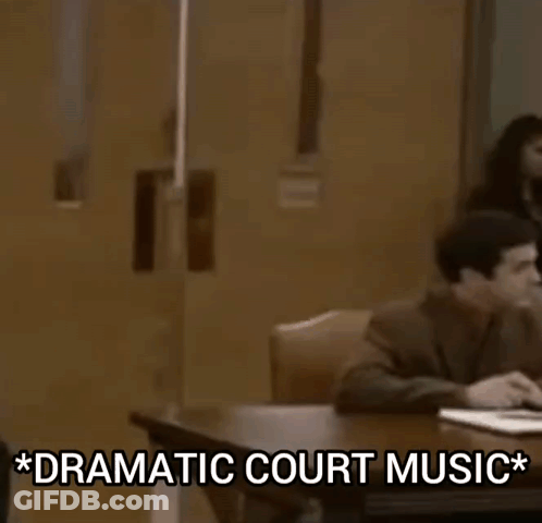 Man In Suit And Tie With Dramatic Court Music GIF