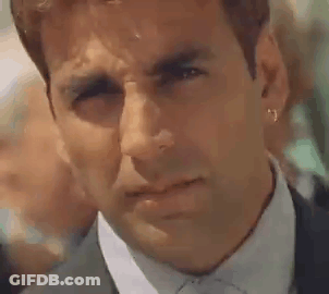 Man In Suit And Tie With Earrings GIF