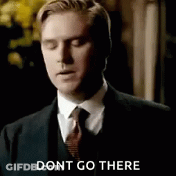 Man In Suit And Tie With Eyes Closed GIF