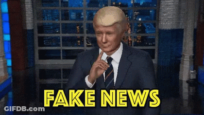 Man In Suit And Tie With Fake News GIF