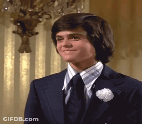 Man In Suit And Tie With Flower Pin GIF