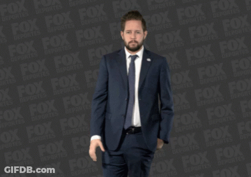 Man In Suit And Tie With Fox Ad GIF