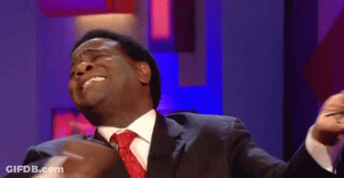 Man In Suit And Tie With Funny Face Pointing GIF
