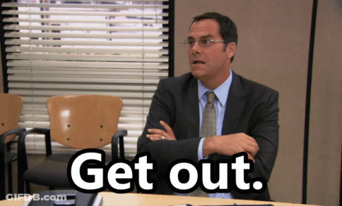 Man In Suit And Tie With Get Out Sign GIF