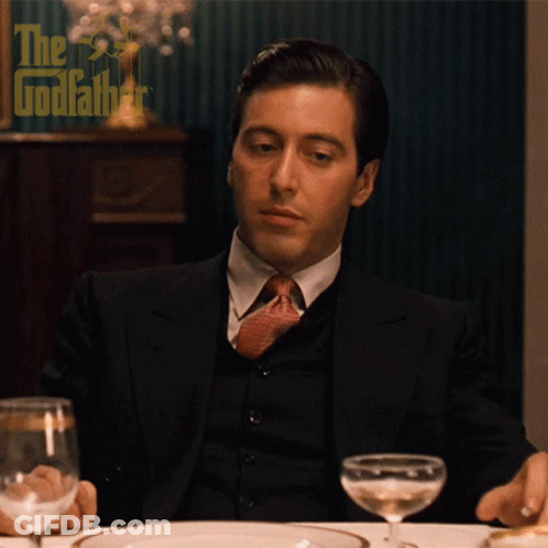 Man In Suit And Tie With Glass Of Wine GIF