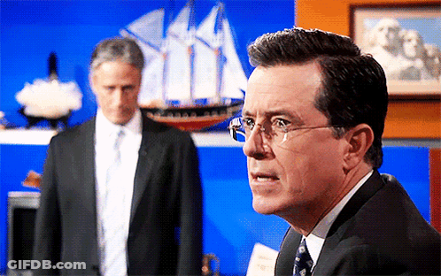 Man In Suit And Tie With Glasses By Model Ship GIF