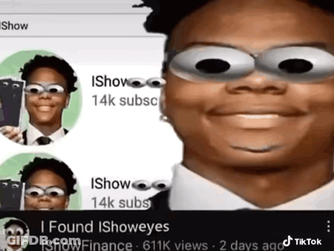 Man In Suit And Tie With Googly Eyes Smiling GIF