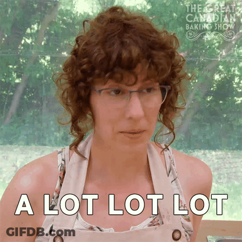 Man In Suit And Tie With Group At Mansion GIF