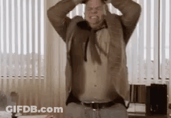 Man In Suit And Tie With Hands On Head GIF