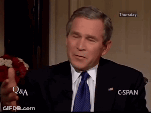 Man In Suit And Tie With Hands On Head GIF