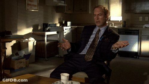 Man In Suit And Tie With Hands Outstretched GIF