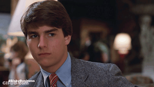 Man In Suit And Tie With Hashtag Riskybusiness GIF
