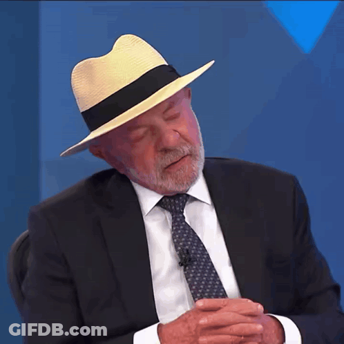 Man In Suit And Tie With Hat And Black Band GIF