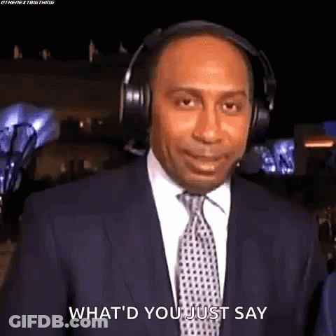 Man In Suit And Tie With Headphones Saying What GIF