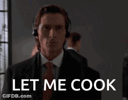 Man In Suit And Tie With Headset Saying Let Me Cook GIF