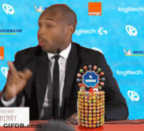 Man In Suit And Tie With Henry Sign GIF