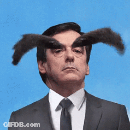 Man In Suit And Tie With Horns GIF