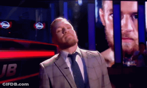 Man In Suit And Tie With Jb Screen GIF