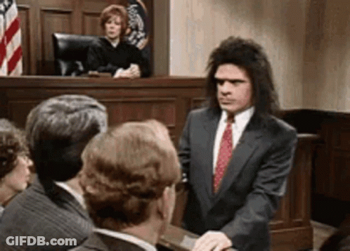 Man In Suit And Tie With Judge GIF