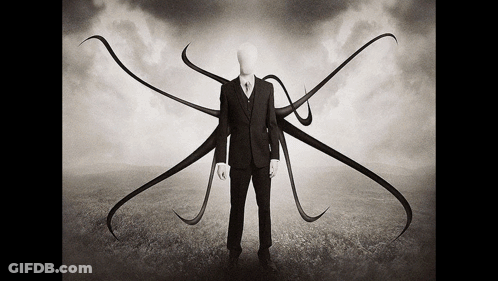 Man In Suit And Tie With Long Arms And Legs GIF