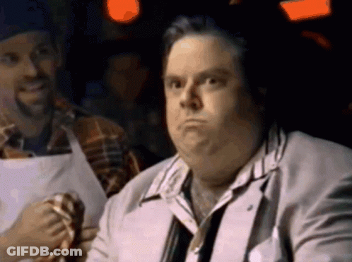 Man In Suit And Tie With Man In Apron GIF